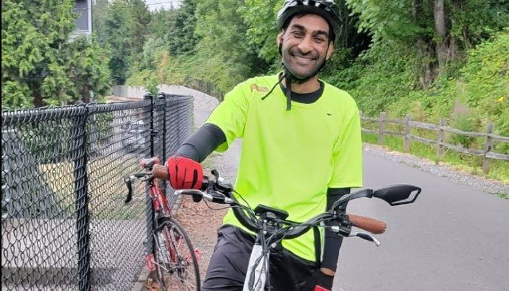 Councilmember Sid Gupta on a bike